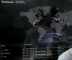 Bogdan Botezatu, a cyberthreats specialist with Bitdefender speaks during an interview with the Associated Press, backdropped by a real time cyber-attacks world map, at the headquarters of Bitdefender in Bucharest, Romania, Wednesday, June 28, 2017. Bogdan Botezatu, a cyberthreats specialist with Bitdefender speaks during an interview with the Associated Press, backdropped by a real time cyber-attacks world map, at the headquarters of Bitdefender in Bucharest, Romania, Wednesday, June 28, 2017.
