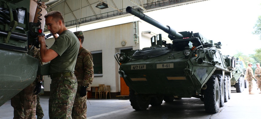 NATO allied soldiers, pictured here, refuel U.S. Stryker vehicles. The reverse proved difficult at a recent multinational exercise in Poland.