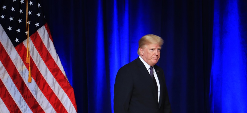 President Donald Trump leaves the stage after laying out a national security strategy in Washington, Dec. 18, 2017.