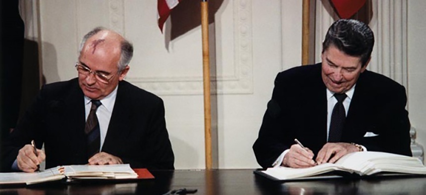 Soviet Leader Mikhail Gorbachev and U.S. president Ronald Reagan sign the Intermediate-Range Nuclear Forces Treaty on December 8, 1987.