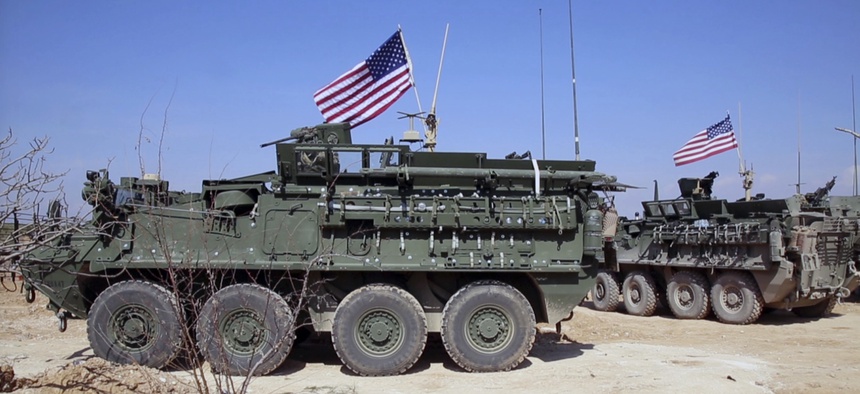 U.S. forces take up positions on the outskirts of the Syrian town, Manbij, March 7, 2017.