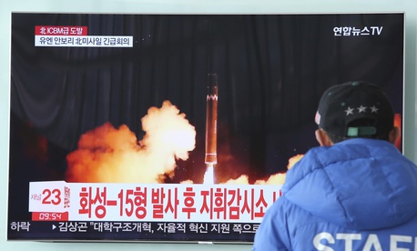A man watches a TV screen showing what the North Korean government calls the Hwasong-15 intercontinental ballistic missile. A man watches a TV screen showing what the North Korean government calls the Hwasong-15 intercontinental ballistic missile.