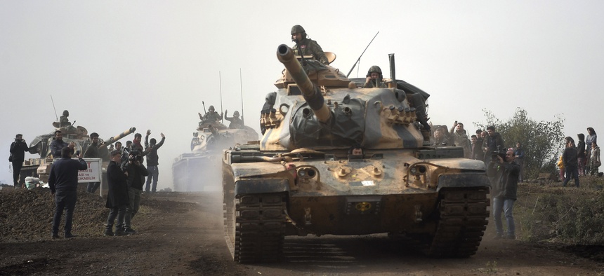 Turkish army tanks leaving Hassa, Hatay, Turkey, and heading for Afrin, an enclave in northern Syria controlled by U.S.-allied Kurdish fighters, on Jan. 22, 2018.