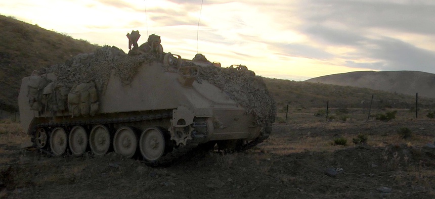 Soldiers with 1st Battalion, 155th Infantry Regiment, Mississippi Army National Guard, provide overwatch in an M113 armored personnel carrier during the battalion’s live fire exercise June 8, 2017, at the National Training Center.