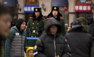 Chinese paramilitary police stand guard outside of the Beijing Railway Station in Beijing, Friday, Feb. 9, 2018.