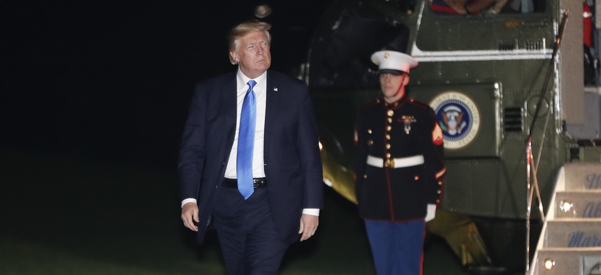 President Donald Trump walks across the South Lawn of the White House in Washington, Wednesday, Oct. 25, 2017, following his return on Marine One helicopter from nearby Andrews Air Force Base, Md.