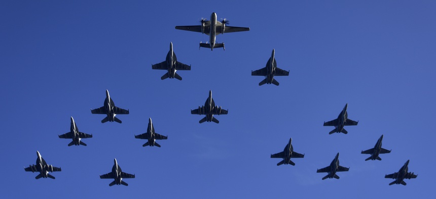 U.S. Navy and Marine Corps aircraft assigned to Carrier Air Wing 11 fly in close formation during a flight demonstration as part of Tiger Cruise 2017 aboard the aircraft carrier USS Nimitz (CVN 68), Nov. 30, 2017, in the Pacific Ocean.