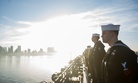 Sailors and Marines aboard the amphibious assault ship USS America (LHA 6) as it returns to its homeport of Naval Base San Diego, Feb. 2, 2018. 