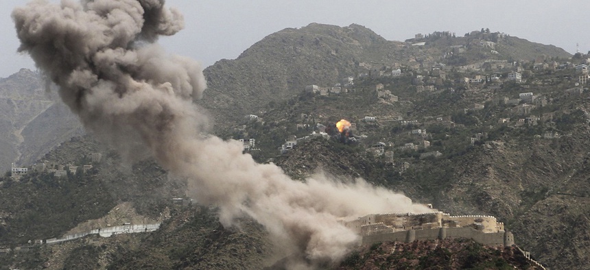 Smoke rises from al-Qahira castle, an ancient fortress near the Saber mountain, in the background, after Saudi-led air strikes in Taiz city, Yemen, May 2015.