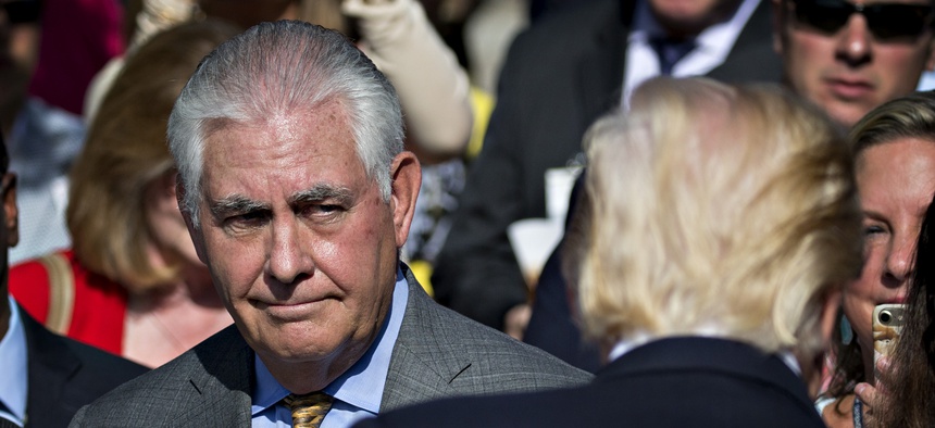 Then-Secretary of State Rex Tillerson, left, looks at U.S. President Donald J. Trump during a ceremony to commemorate the September 11, 2001 terrorist attacks, at the Pentagon in Washington, D.C., on Sept. 11, 2017.