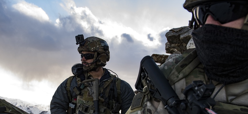 U.S. Air Force pararescuemen, assigned to the 83rd Expeditionary Rescue Squadron, survey the landscape during a training exercise at an undisclosed location in the mountains of Afghanistan, March 14, 2018.