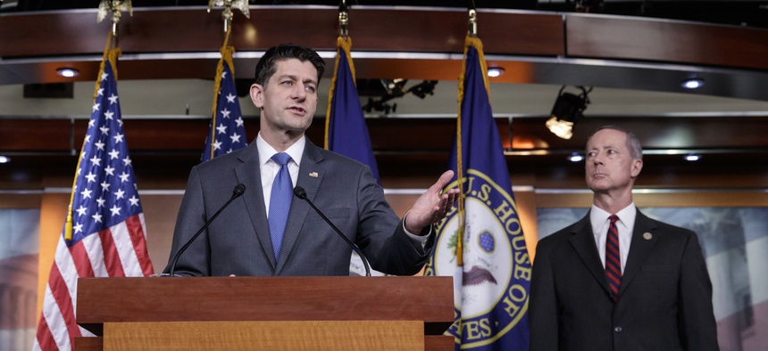Speaker of the House Paul Ryan, R-Wis., joined by House Armed Services Committee Chairman Mac Thornberry, R-Texas, right, speaks about the massive government spending bill moving through Congress.