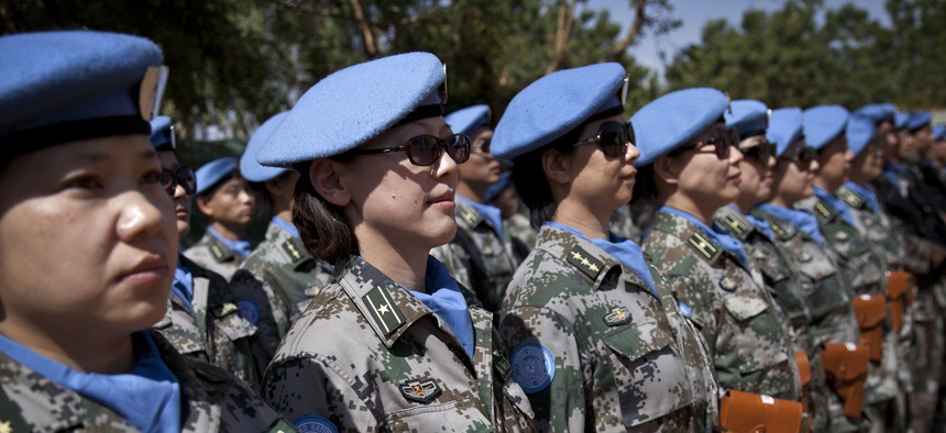 UN peacekeepers from China stand at attention during the 2014 visit of the leader of the UN Multidimensional Integrated Stabilization Mission in Mali (MINUSMA), at the Chinese camp in Gao.