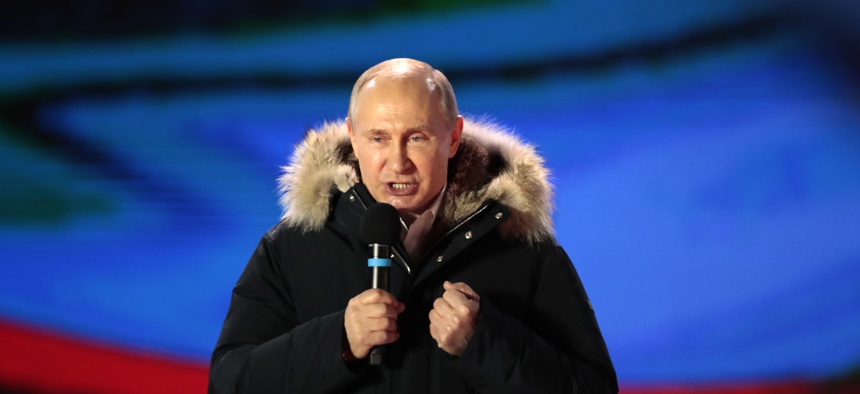 Russian President Vladimir Putin speaks during a rally near the Kremlin in Moscow, Sunday, March 18, 2018.