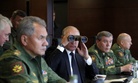 Russian President Vladimir Putin, center, Defence Minister Sergei Shoigu, left, and Chief of the General Staff of the Russian Armed Forces Valery Gerasimov, second right, watch a military exercise at a training ground at the Luzhsky Range. Sept, 2017.