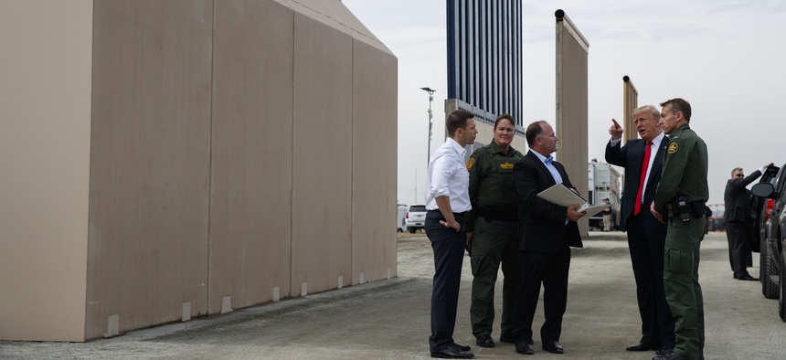 President Donald Trump reviews border wall prototypes, March 13, 2018, in San Diego.