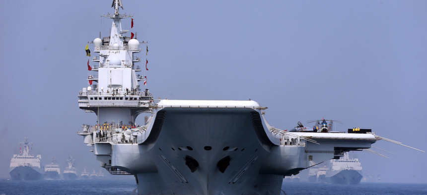 China's aircraft carrier Liaoning and other vessels and fighter jets in the maritime parade conducted by the Chinese People's Liberation Army (PLA) Navy in the South China Sea on the morning of April 12, 2018.