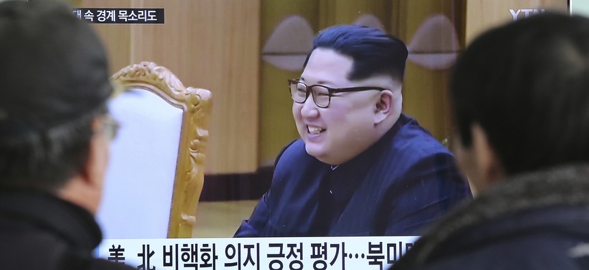 People watch a TV screen showing North Korean leader Kim Jong Un at the Seoul Railway Station in Seoul, South Korea, on March 7, 2018.