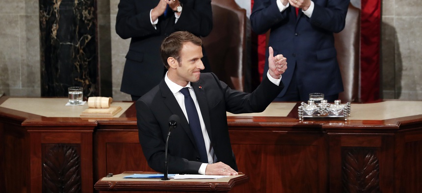 French President Emmanuel Macron spoke to a joint meeting of Congress in Washington, Wed., April 25, 2018. Behind him is Vice Pres. Mike Pence and House Speaker Paul Ryan, R-Wisc.