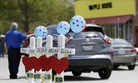 Four wooden crosses stand as a memorial for the four shooting fatalities outside a Waffle House restaurant Wednesday, April 25, 2018, in Nashville, Tenn. 