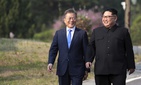 North Korean leader Kim Jong Un, right, and South Korean President Moon Jae-in walk together at the border village of Panmunjom in the Demilitarized Zone, South Korea, Friday, April 27, 2018. 