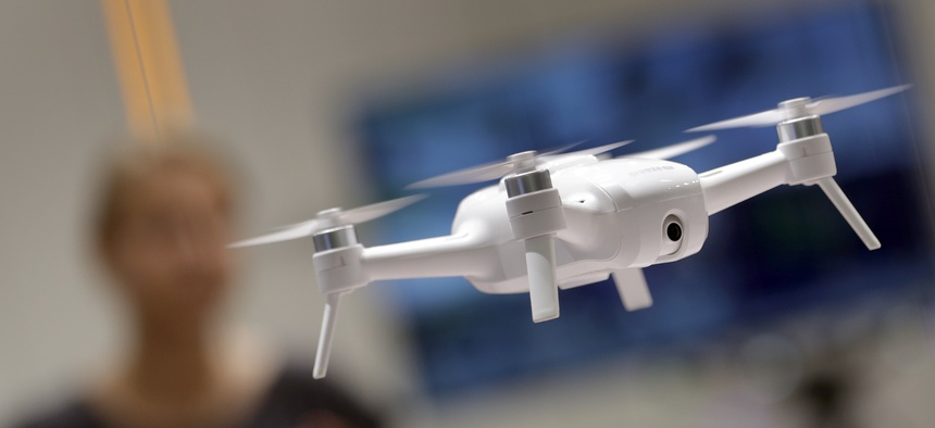 Melanie Richter controls the Yuneec selfie drone 'Breeze 4K' with a smartphone at the IFA 2017 tech fair in Berlin, Germany, Thursday, Aug. 31, 2017