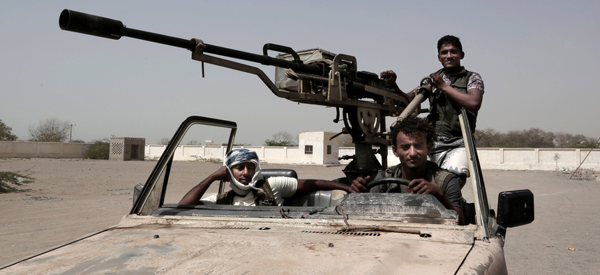In this Feb. 12, 2018 photo, young Saudi-led backed forces, part of Ahmed Al-Kawkabani's southern resistance unit in Hodeida, patrol al-Khoukha, Yemen. Young men, some as young as 12, have served on the front lines throughout Yemen’s 3-year-old war.
