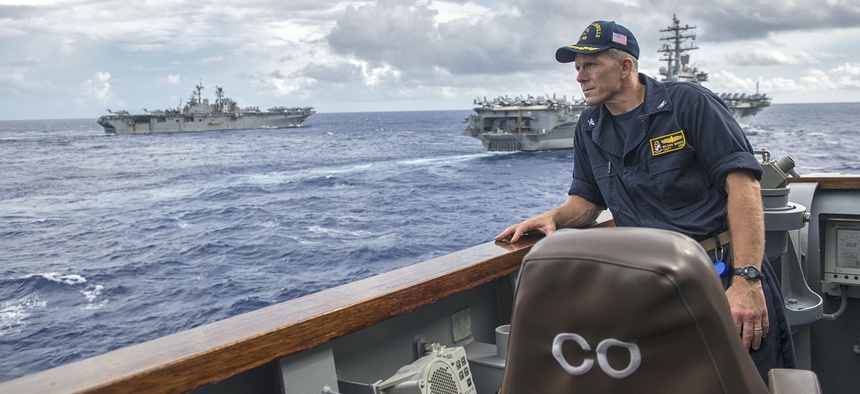 Capt. Wilson Marks, commanding officer of the Ticonderoga-class guided-missile cruiser USS Chancellorsville (CG 62), stands on the bridge wing in 2016.