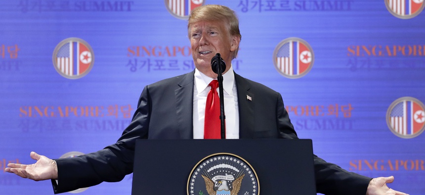 U.S. President Donald Trump answers questions about the summit with North Korea leader Kim Jong Un during a press conference at the Capella resort on Sentosa Island Tuesday, June 12, 2018 in Singapore.