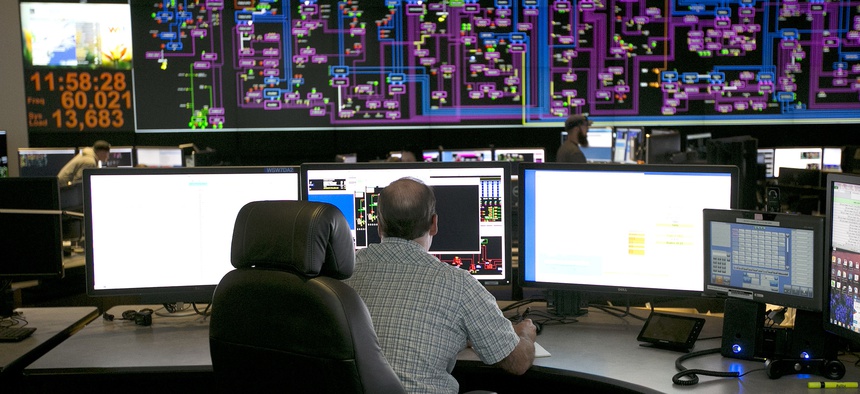 Electrical power flow and conditions are monitored at the Pacific Gas & Electric grid control center, Thursday, Aug. 17, 2017, in Vacaville, Calif.