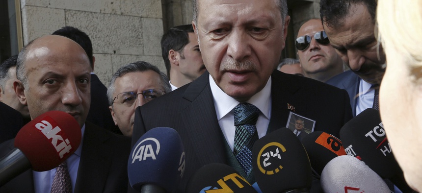 Turkish President Recep Tayyip Erdogan speaks to the media members at the parliament in Ankara, Turkey, Tuesday, March 20, 2018.