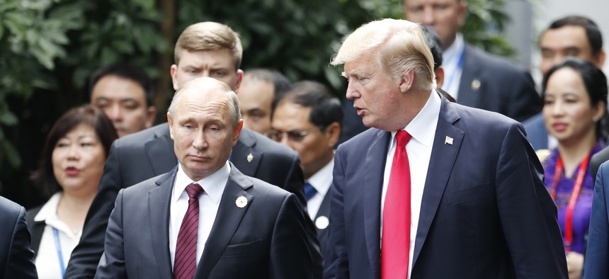 In this Nov. 11, 2017, file photo President Donald Trump, right, and Russia's President Vladimir Putin talk during the family photo session at the APEC Summit in Danang, Vietnam.