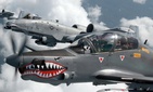 A Colombian Air Force A-29B Super Tucano flies alongside two U.S. Air Force A-10s during Exercise Green Flag East August 2016. A Colombian Air Force A-29B Super Tucano flies alongside two U.S. Air Force A-10s during Exercise Green Flag East August 2016.