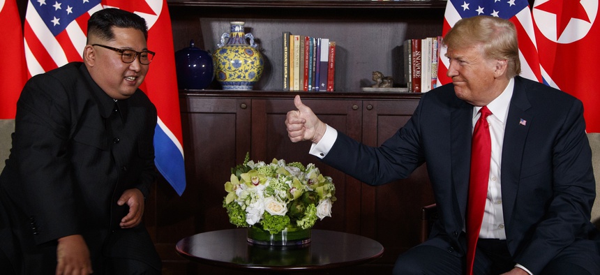 President Donald Trump meets with North Korean leader Kim Jong Un on Sentosa Island, Tuesday, June 12, 2018, in Singapore.