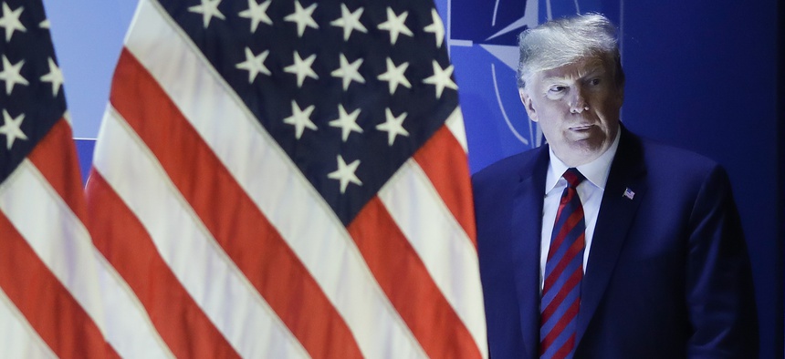 U.S. President Donald Trump arrives for a news conference during a summit of heads of state and government at NATO headquarters in Brussels on Thursday, July 12, 2018.