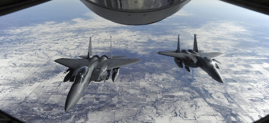 The proposed F-15X will have a one-person cockpit, not the pilot-and-weaponeer team in these F-15E Strike Eagles.