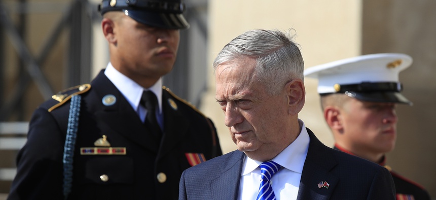 Secretary of Defense Jim Mattis, stands on the steps of the River entrance to the Pentagon, Friday, July 27, 2018.