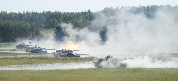 A Challenger II main battle tank from the United Kingdom fires its main gun. U.S. Army Europe and the German Army co-host the third Strong Europe Tank Challenge at Grafenwoehr Training Area, June 3 - 8, 2018.