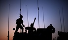 Soldiers with the Canadian Army's 1st Battalion 22nd Royal Regiment prepare for an operation at sunrise Monday, June 27, 2011 on Forward Operating Base Sperwan Ghar in the Panjwaii district of Kandahar province, Afghanistan