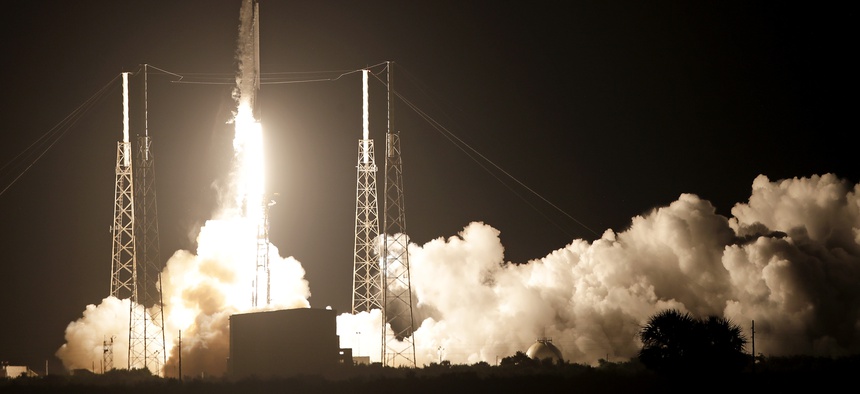 A Falcon 9 SpaceX rocket lifts off from the Cape Canaveral Air Force Station Complex 40 launch pad as seen through a time exposure in Cape Canaveral, Fla., Tuesday, Aug. 7, 2018.