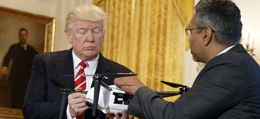 George Mathew, CEO of Kespry, shows a drone to President Donald Trump during the "American Leadership in Emerging Technology" event in the East Room of the White House, Thursday, June 22, 2017.