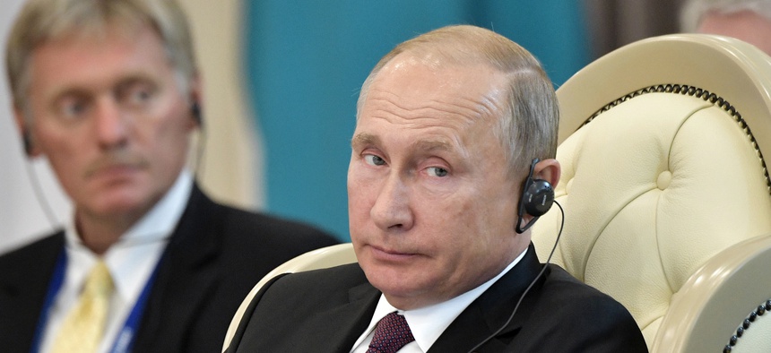 ussian President Vladimir Putin and presidential spokesman Dmitry Peskov, left, attend a meeting during the 5th Caspian summit in Aktau, the Caspian Sea port in Kazakhstan, Sunday, Aug. 12, 2018.