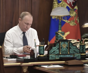 Vladimir Putin sits in his Kremlin cabinet prior his inauguration ceremony as new Russia's president in Moscow, Russia, Monday, May 7, 2018. Putin won the six-year term in March elections where he tallied 77 percent of the vote.