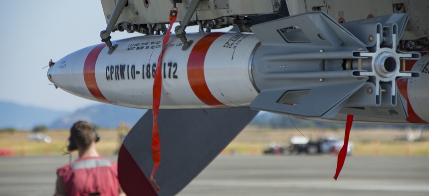 A Mark-63 Quickstrike Mine is mounted on a P-3 Orion aircraft at Oak Harbor, Washington, on July 25, 2018.