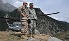 Brig. Gen. Mike Nagata, (left) deputy chief of the Office of the Defense Representative Pakistan and Vice Admiral Mike LeFever, commander of ODRP, watch as relief supplies are offloaded from a U.S. Army UH-60 Black Hawk in Uthror, Pakistan in 2010. 