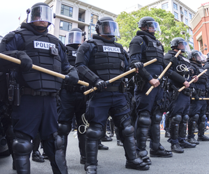 Riot police in full tactical gear stand ready to confront protesters at a Trump rally at the San Diego Convention Center on May 27, 2016. Riot police in full tactical gear stand ready to confront protesters at a Trump rally at the San Diego Convention Center on May 27, 2016.