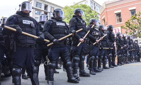 Riot police in full tactical gear stand ready to confront protesters at a Trump rally at the San Diego Convention Center on May 27, 2016. Riot police in full tactical gear stand ready to confront protesters at a Trump rally at the San Diego Convention Center on May 27, 2016.