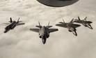Two F-22 Raptors fly with two Norwegian F-35s in Norway.