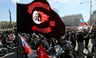 Members and supporters of the Russian motorcycle club Night Wolves arrive at the heroes' monument of the Red Army, background left, in downtown Vienna, Austria, Friday, May 6, 2016.