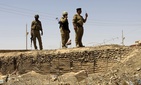In this Friday, July 20, 2012 file photo, Iraqi soldiers patrol along the border between Syria and Iraq in Anbar province, Iraq. In this Friday, July 20, 2012 file photo, Iraqi soldiers patrol along the border between Syria and Iraq in Anbar province, Iraq.